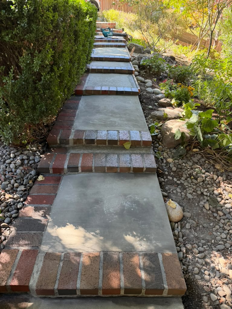 Restored concrete and brick steps climbing the Lafayette hillside garden